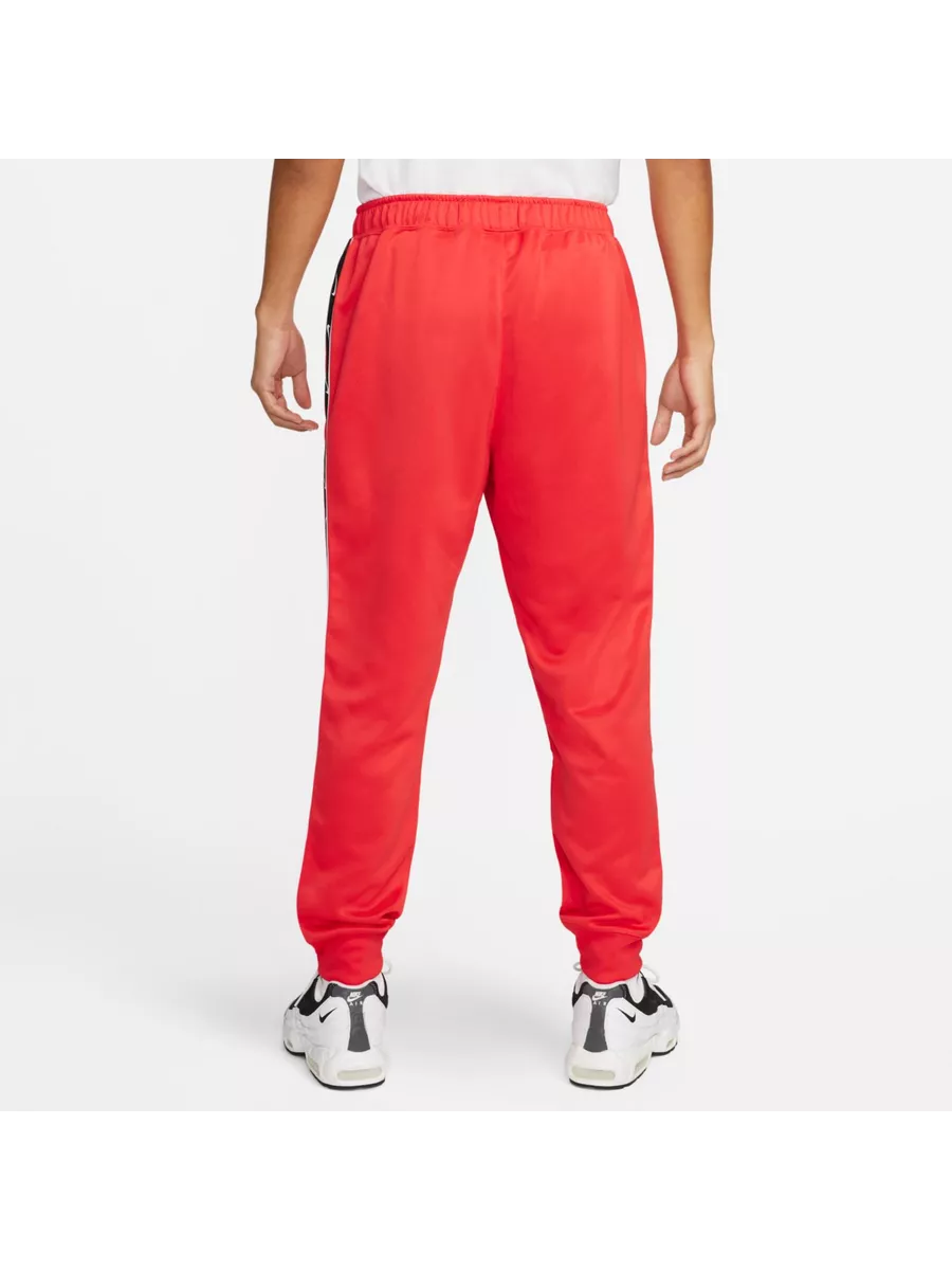 Nike guppy track pants best sale